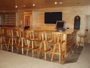 Whispering Pines projects interior log bar area