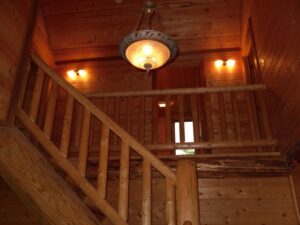Whispering Pines projects log interior staircase
