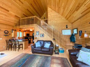 Whispering Pines projects log home interior main floor & loft stairs
