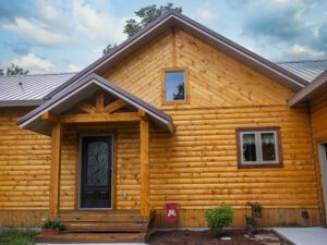 Whispering pines project log exterior home with covered entry